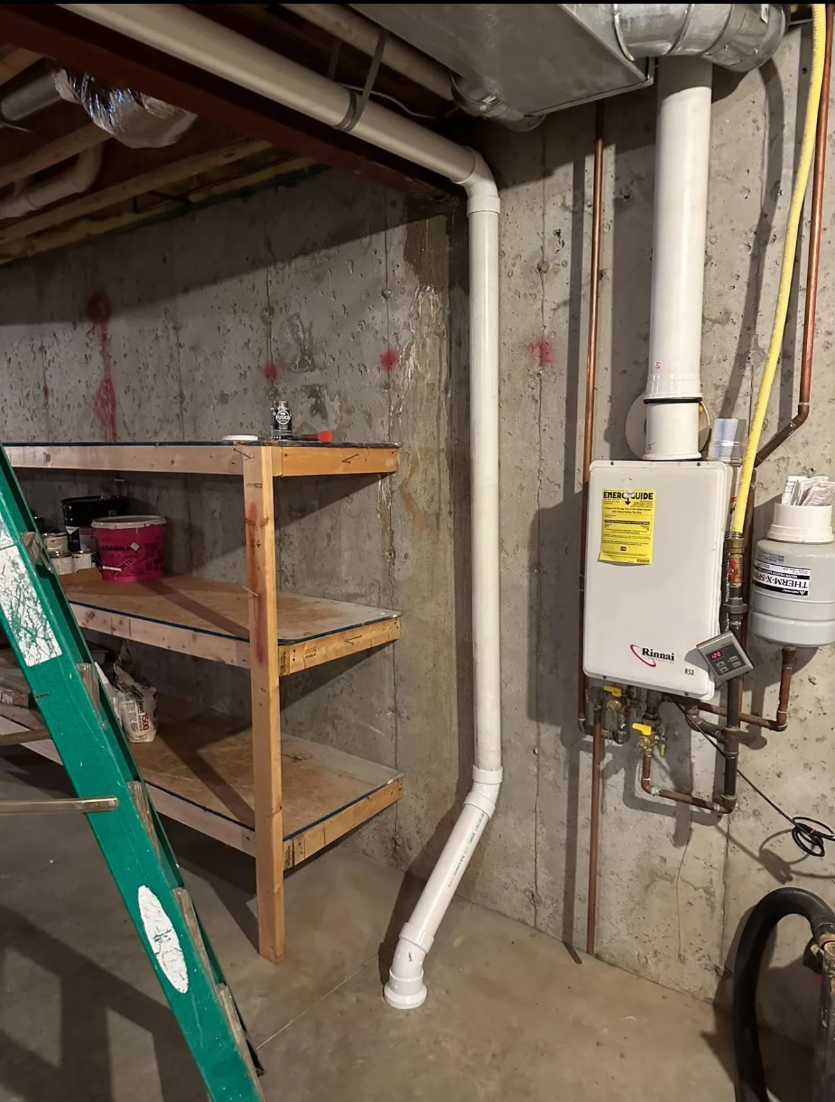 Radon vent pipe routed through a utility room